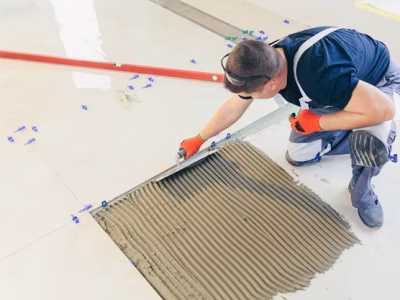 Tiling Works builder who installs floor with large ceramic tiles repair work 321831 2582.avif
