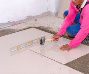 worker laying ceramic tile floor knock smooth floor 330609 1325.avif worker laying ceramic tile floor knock smooth floor 330609 1325.avif