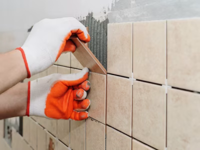 Tiling Works worker putting tiles wall kitchen 191163 230.avif
